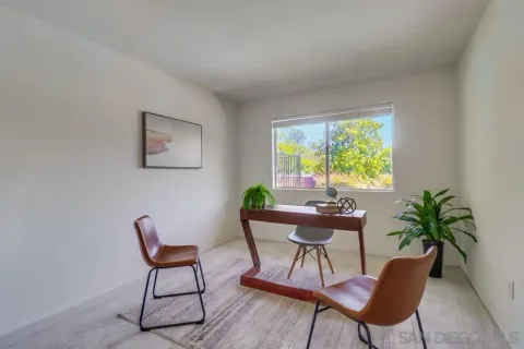 a dining room with furniture and window