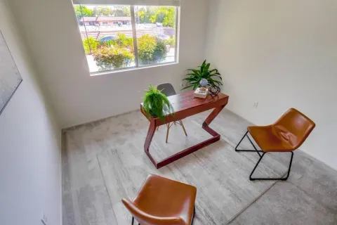 a living room with furniture and a window