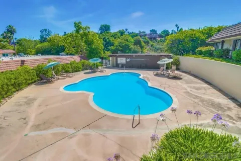 an aerial view of a house with yard and outdoor seating
