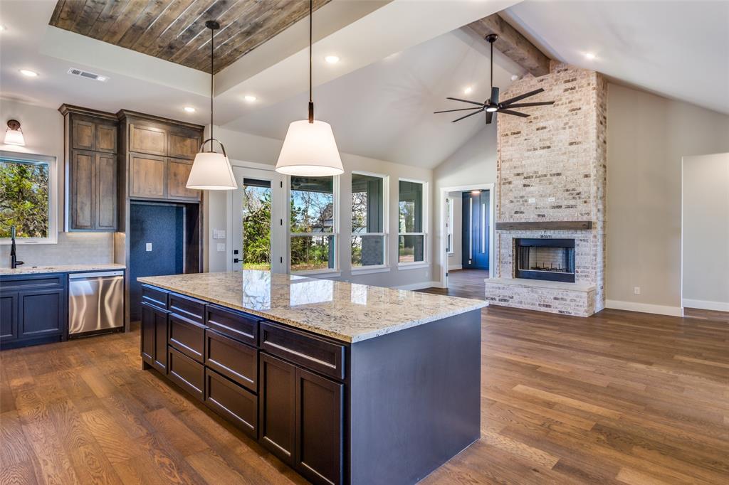 555 Aermotor Loop Weatherford, TX 76085 - Photo 10 of 30 a kitchen with a stove and a wooden floor