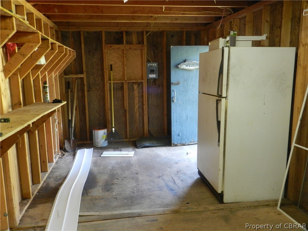 3330 Pine Grove Road Gloucester, VA 23061 - Photo 27 of 32 Inside shed, lots of shelves and workspace as well as an extra Frig to keep refreshments etc.
