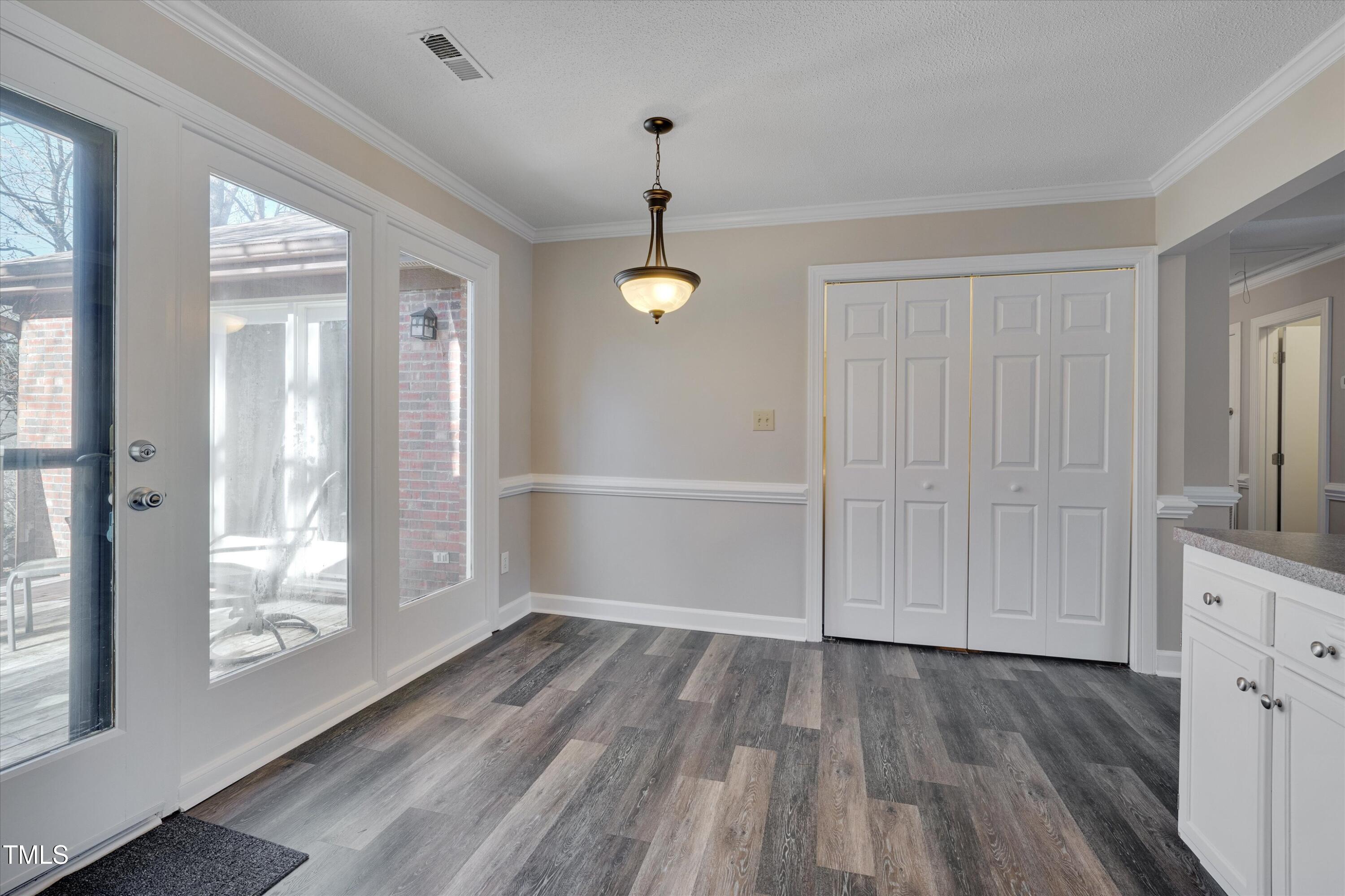 5500 Fortunes Ridge Drive, Unit 67B Durham, NC 27713 - Photo 11 of 34 a view of empty room with wooden floor and fan