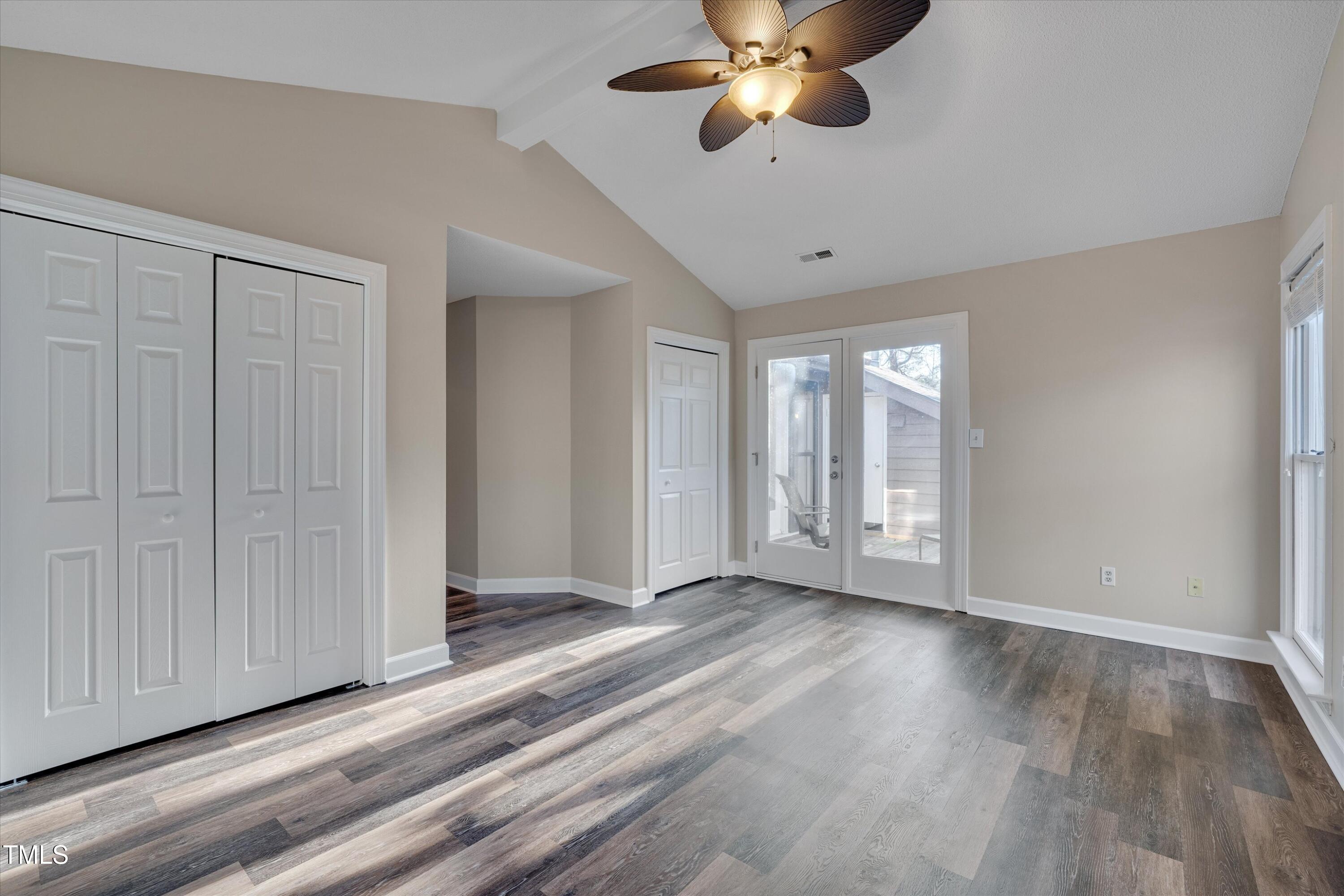 5500 Fortunes Ridge Drive, Unit 67B Durham, NC 27713 - Photo 20 of 34 a view of an empty room with a window and wooden floor