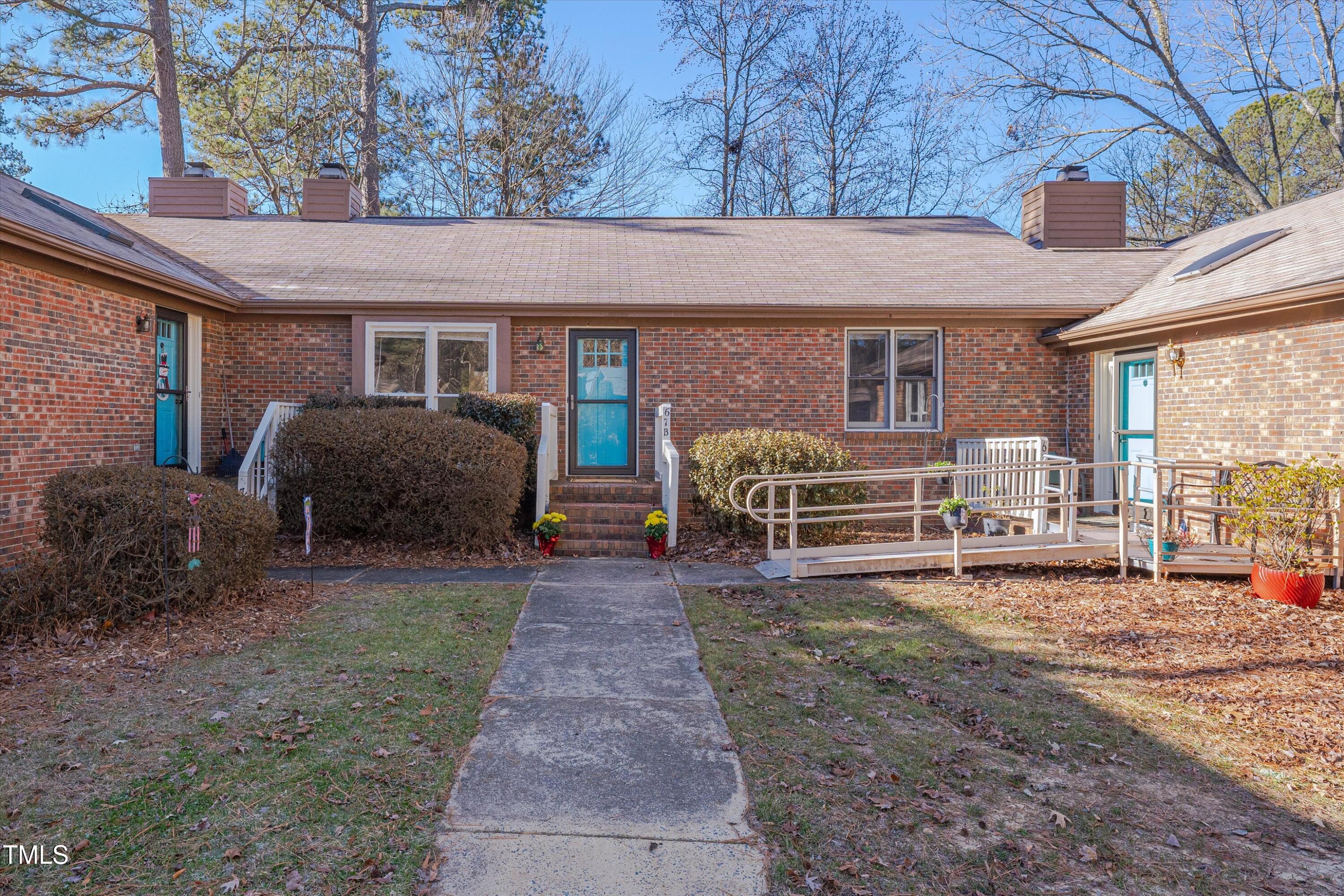 5500 Fortunes Ridge Drive, Unit 67B Durham, NC 27713 - Photo 2 of 34 a house with garden in front of it