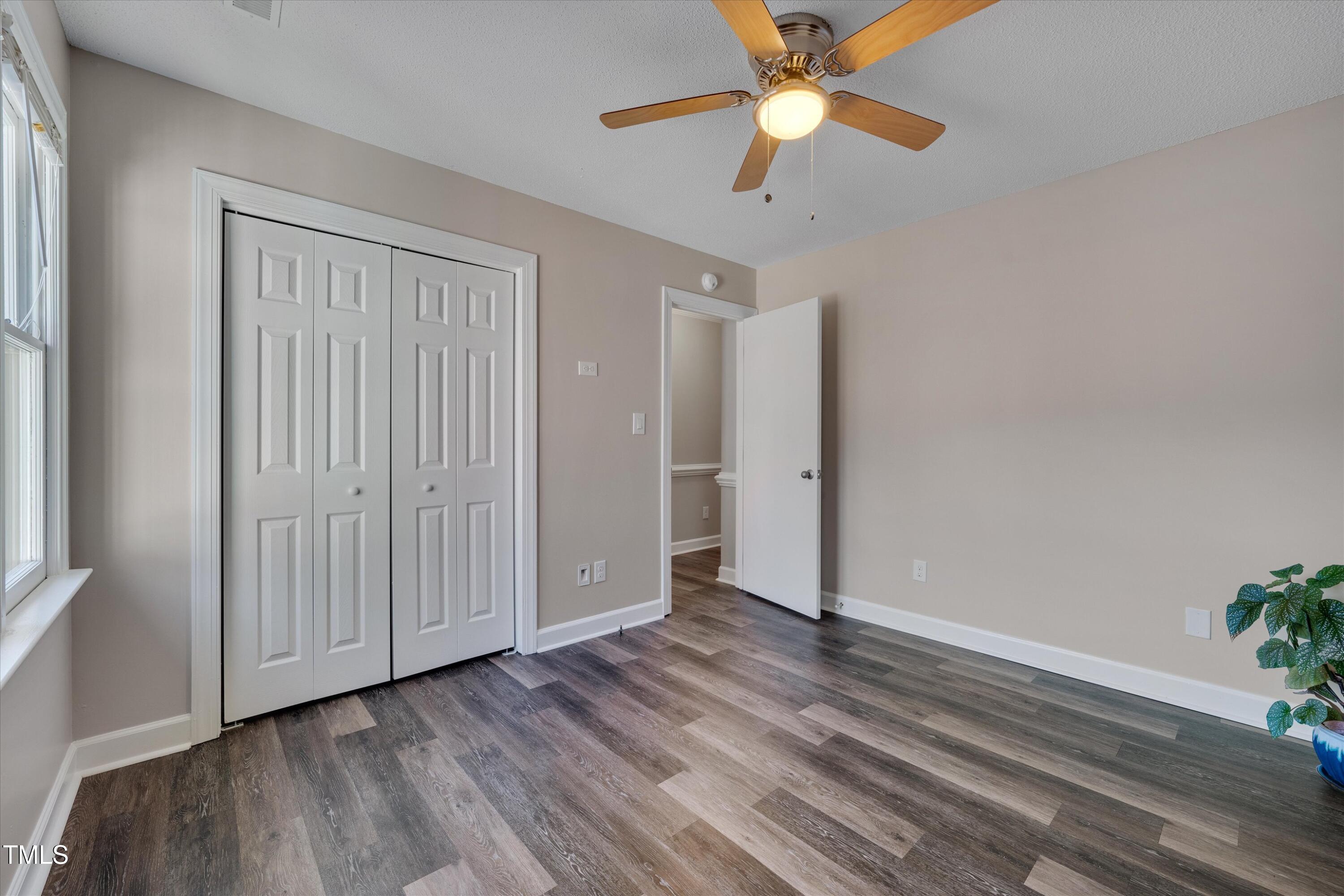 5500 Fortunes Ridge Drive, Unit 67B Durham, NC 27713 - Photo 24 of 34 wooden floor in an empty room with a window