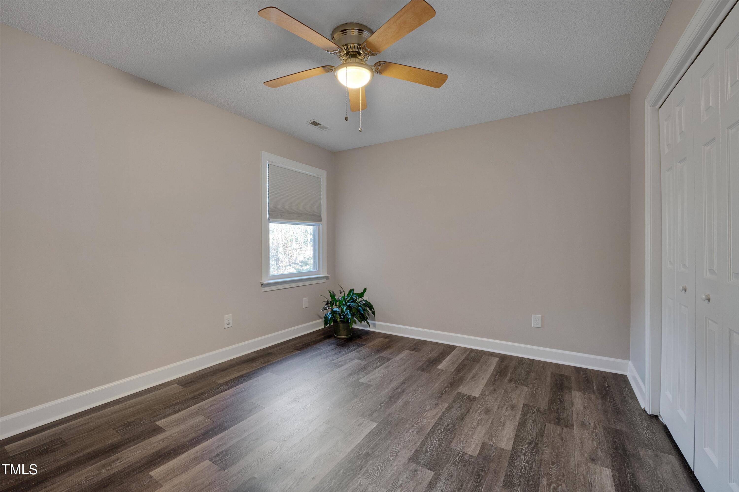 5500 Fortunes Ridge Drive, Unit 67B Durham, NC 27713 - Photo 25 of 34 wooden floor in an empty room with a window