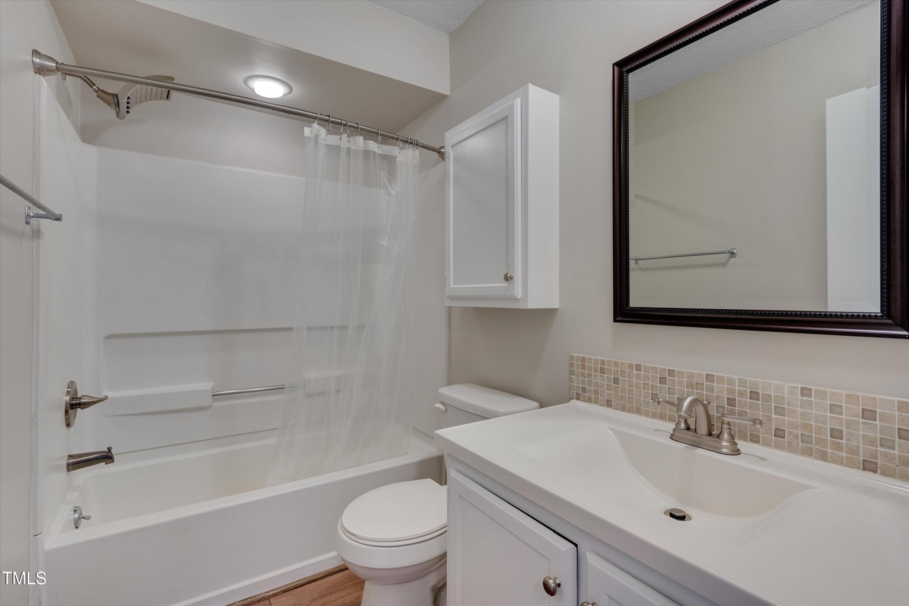 5500 Fortunes Ridge Drive, Unit 67B Durham, NC 27713 - Photo 26 of 34 a bathroom with a sink toilet and shower