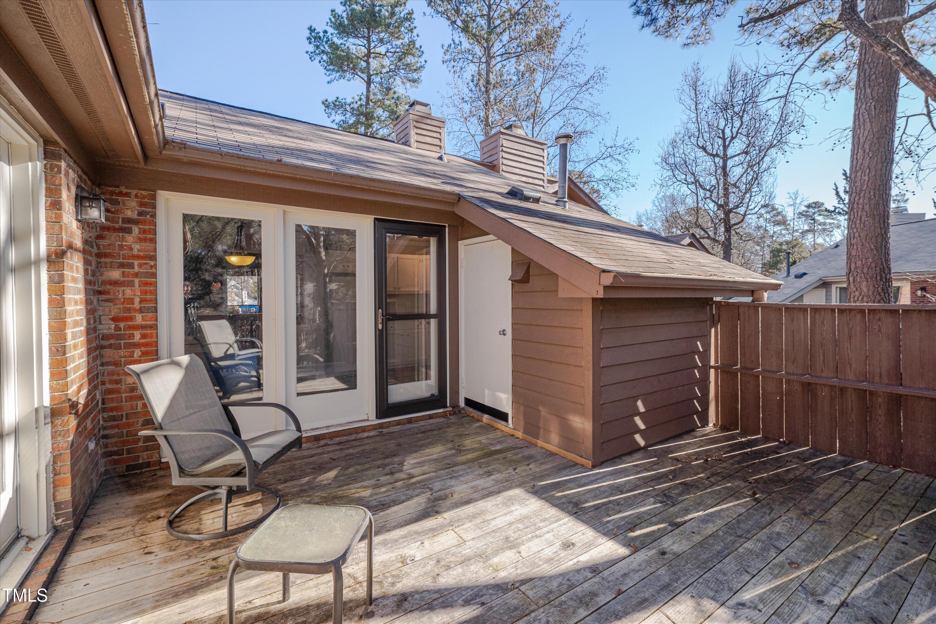5500 Fortunes Ridge Drive, Unit 67B Durham, NC 27713 - Photo 29 of 34 a view of house with patio outdoor seating and covered with trees