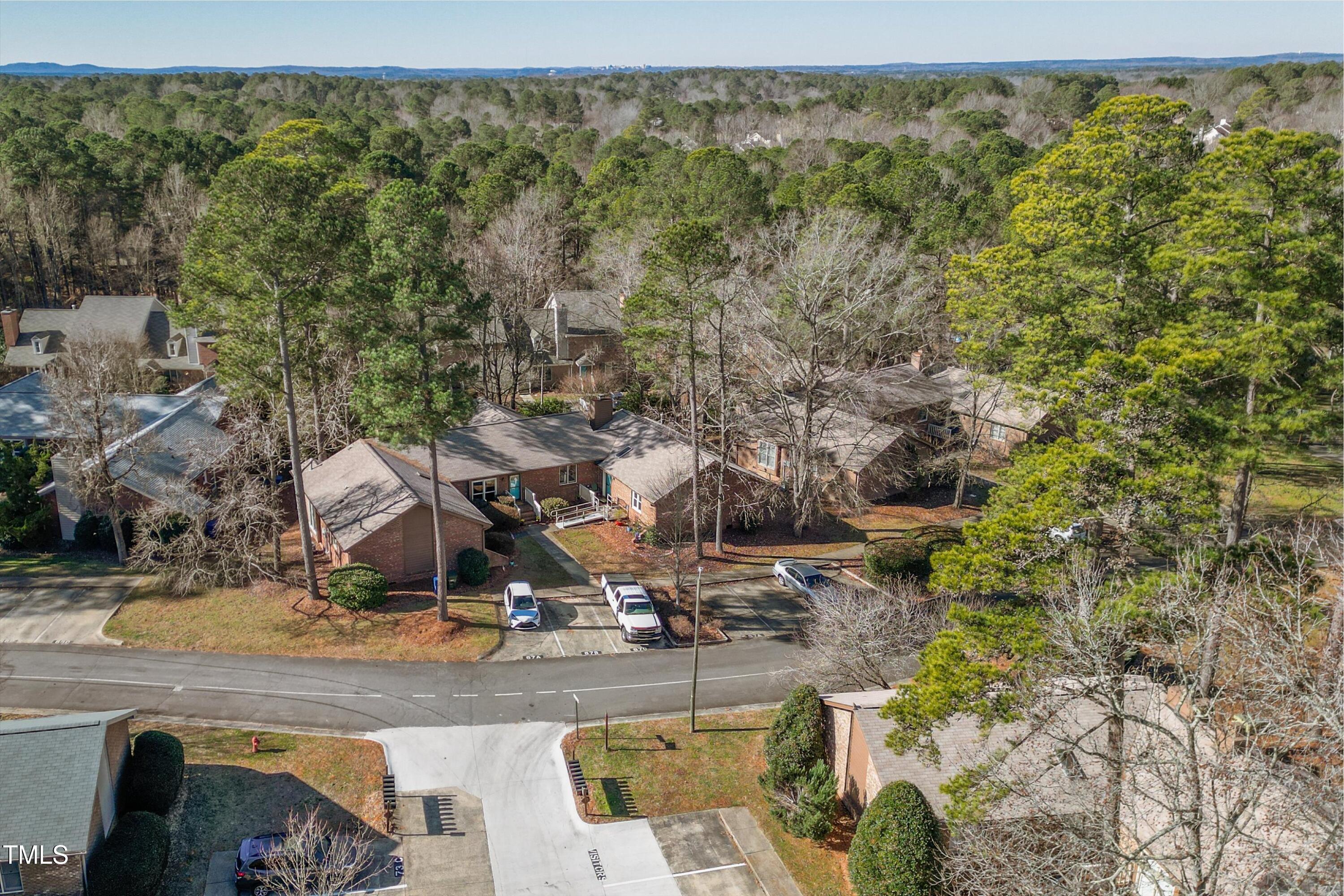 5500 Fortunes Ridge Drive, Unit 67B Durham, NC 27713 - Photo 32 of 34 a view of a house with a yard