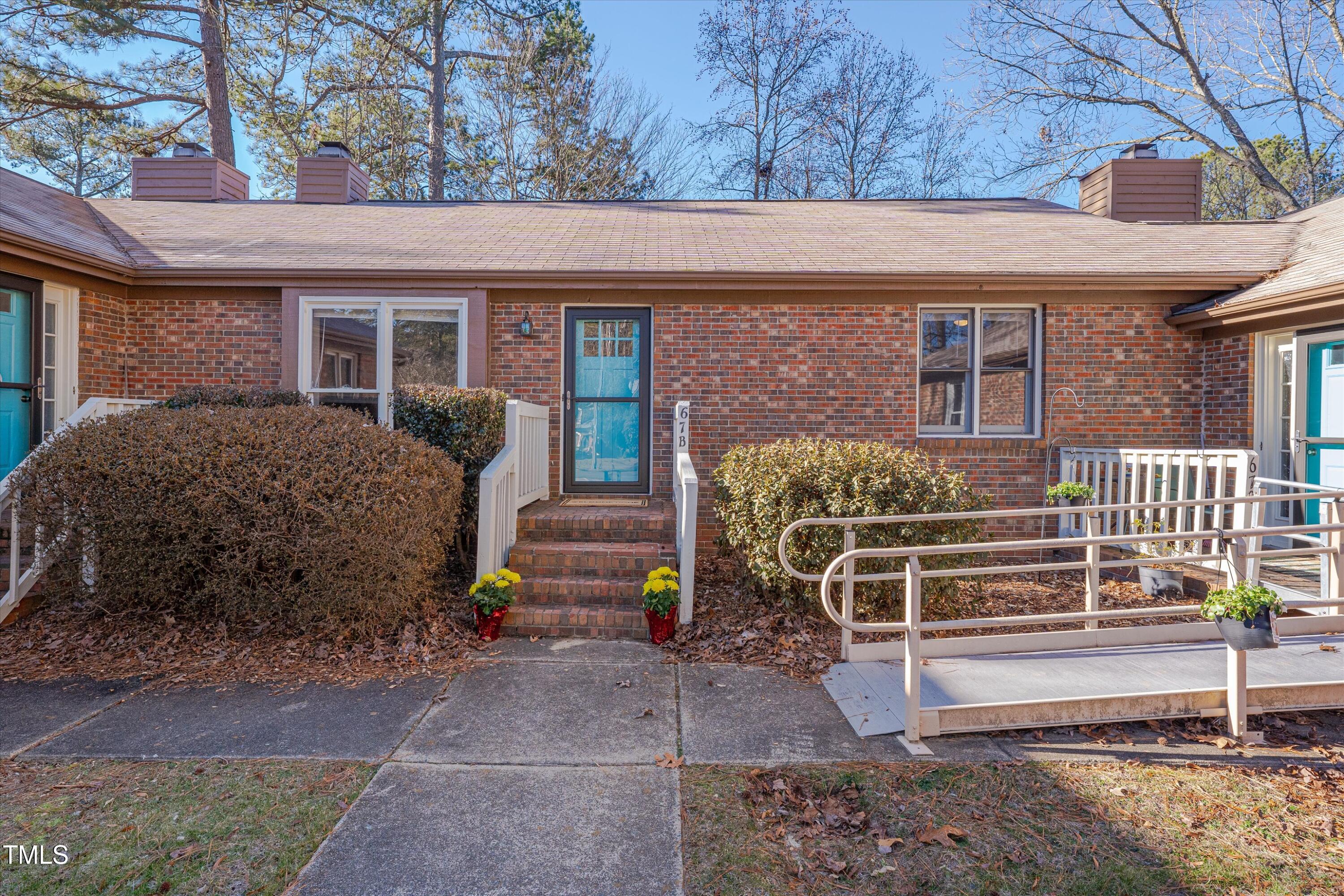 5500 Fortunes Ridge Drive, Unit 67B Durham, NC 27713 - Photo 34 of 34 a view of a house with a yard and wooden fence