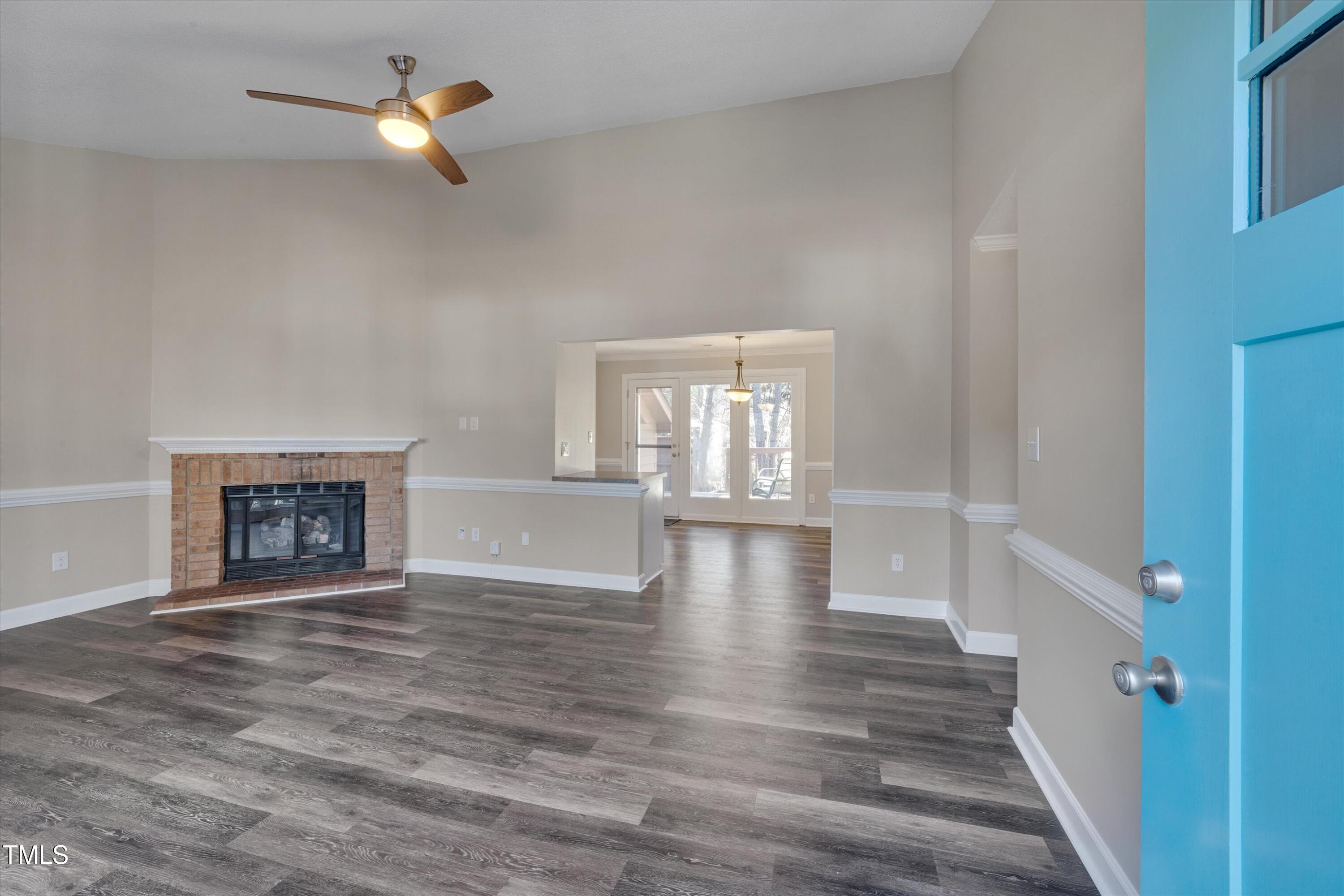 5500 Fortunes Ridge Drive, Unit 67B Durham, NC 27713 - Photo 5 of 34 a view of an empty room with a window and fireplace