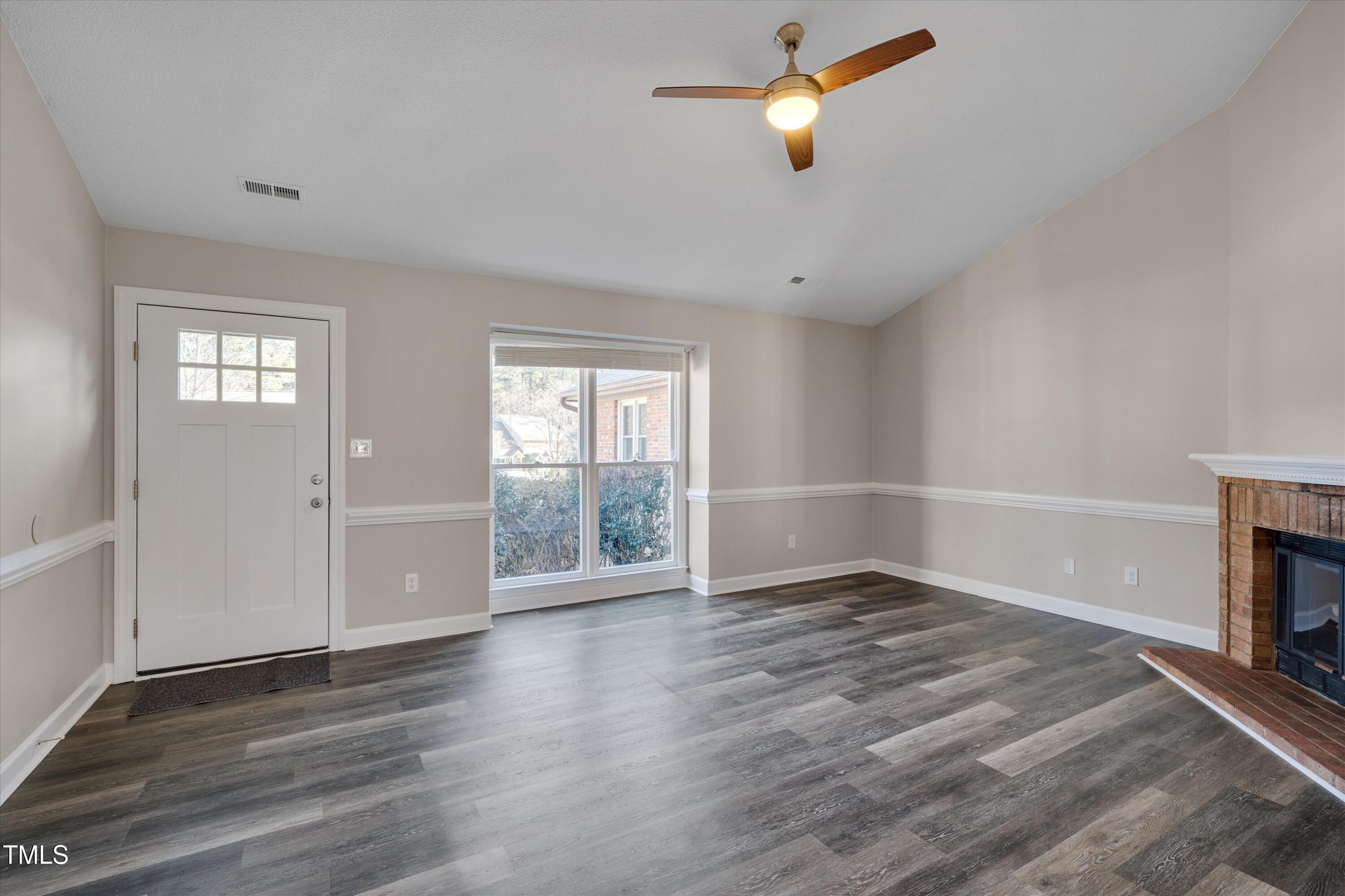 5500 Fortunes Ridge Drive, Unit 67B Durham, NC 27713 - Photo 6 of 34 wooden floor in an empty room with a window