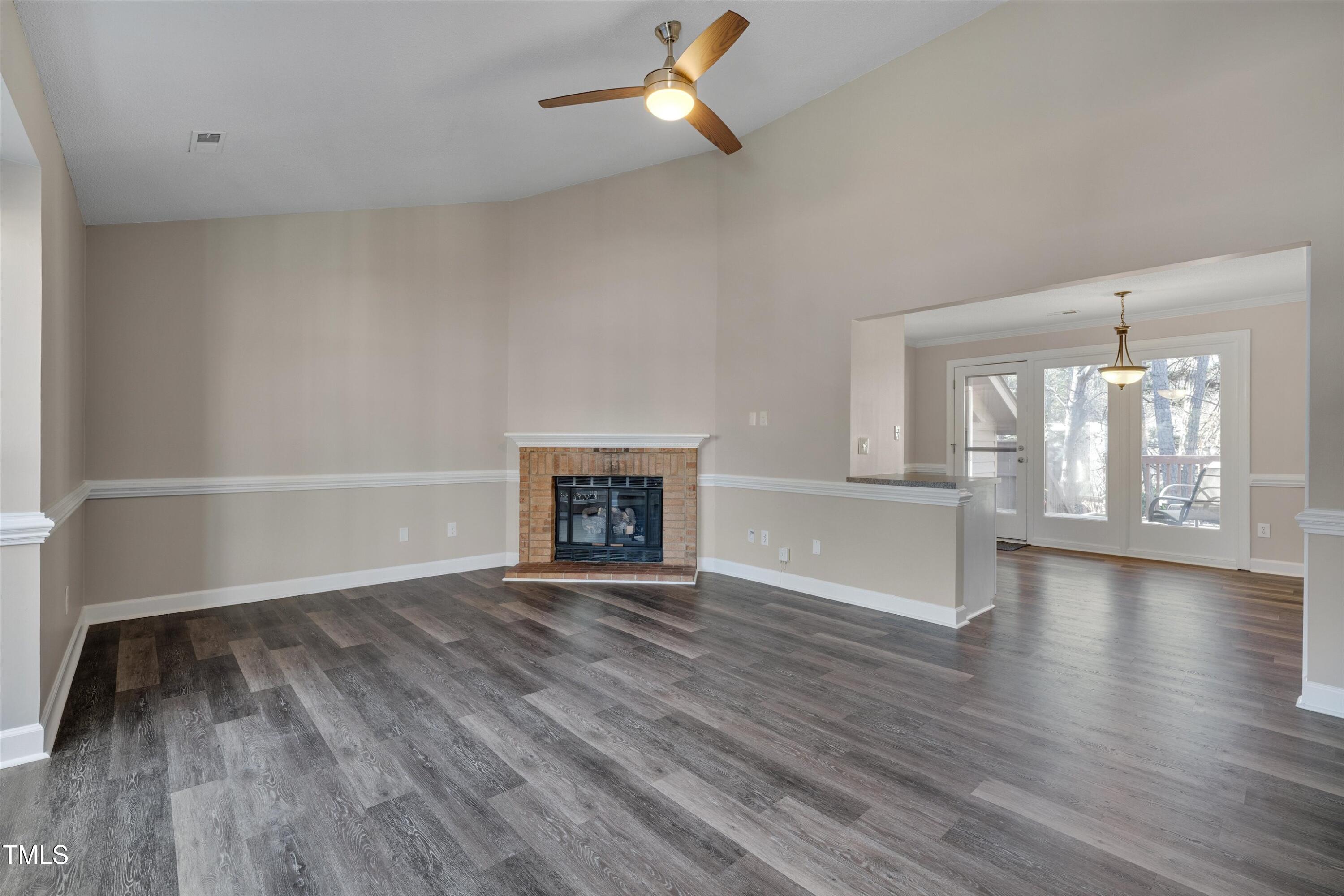5500 Fortunes Ridge Drive, Unit 67B Durham, NC 27713 - Photo 7 of 34 wooden floor in an empty room with a window