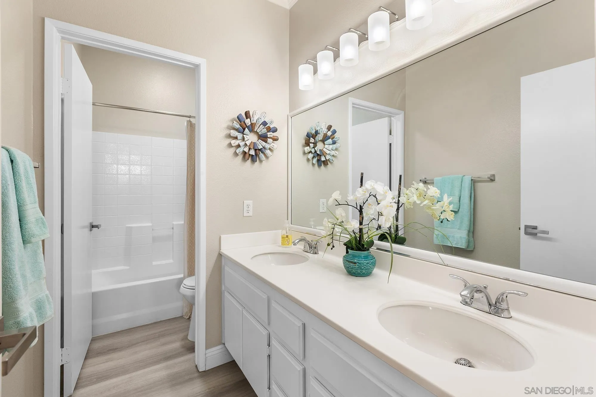 33451 Victoria Court Temecula, CA 92592 - Photo 26 of 38 a bathroom with a double vanity sink mirror and shower