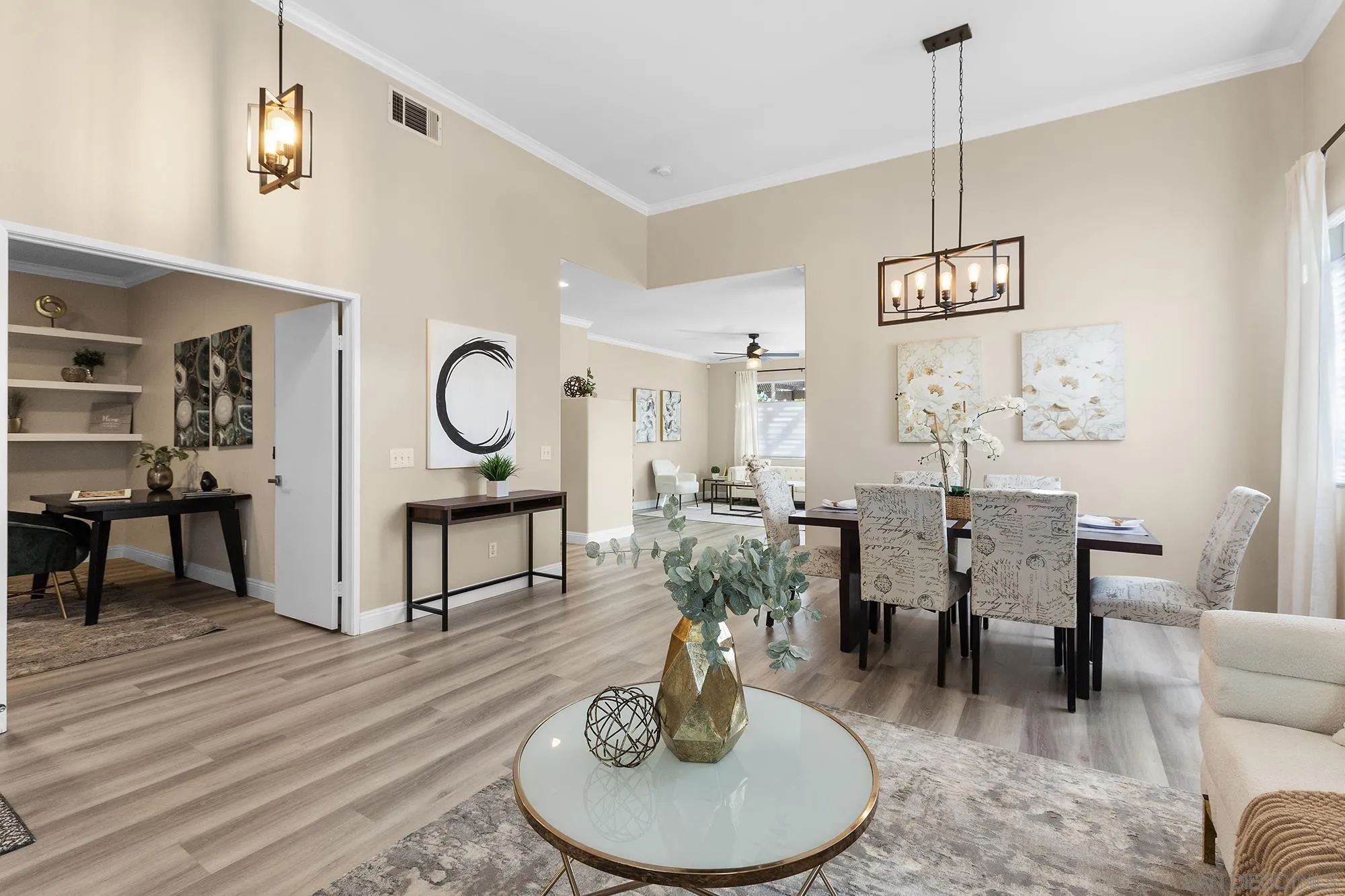 33451 Victoria Court Temecula, CA 92592 - Photo 8 of 38 a living room with furniture a dining table and paintings on the wall