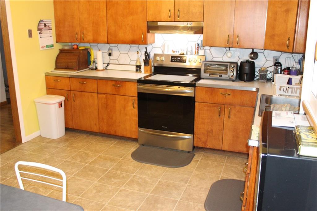 44 Mc Millan Road Mercer, PA 16137 - Photo 3 of 19 a kitchen with a sink appliances and cabinets