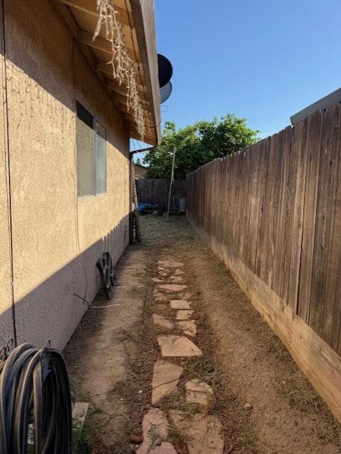 4132 Ruth Avenue Modesto, CA 95355 - Photo 24 of 41 Side path to backyard from living room glass slider.