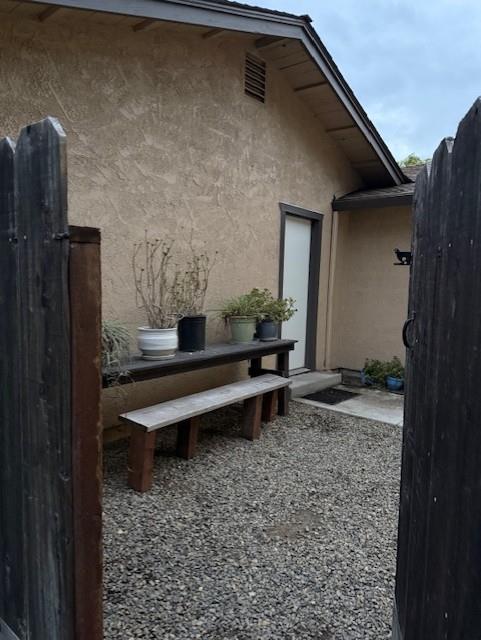 4132 Ruth Avenue Modesto, CA 95355 - Photo 4 of 41 Fenced outside area between the unit and detached garage. Access is through unit by glass slider or gated entry to the front.