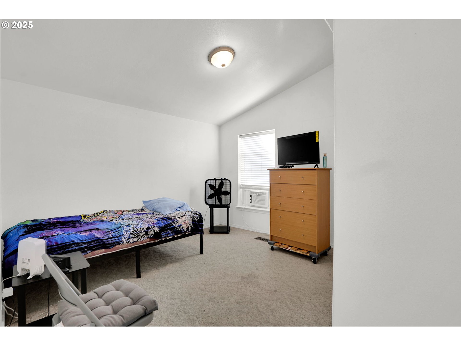 5365 Cobblestone Lane Eugene, OR 97402 - Photo 21 of 40 a living room with furniture and a flat screen tv