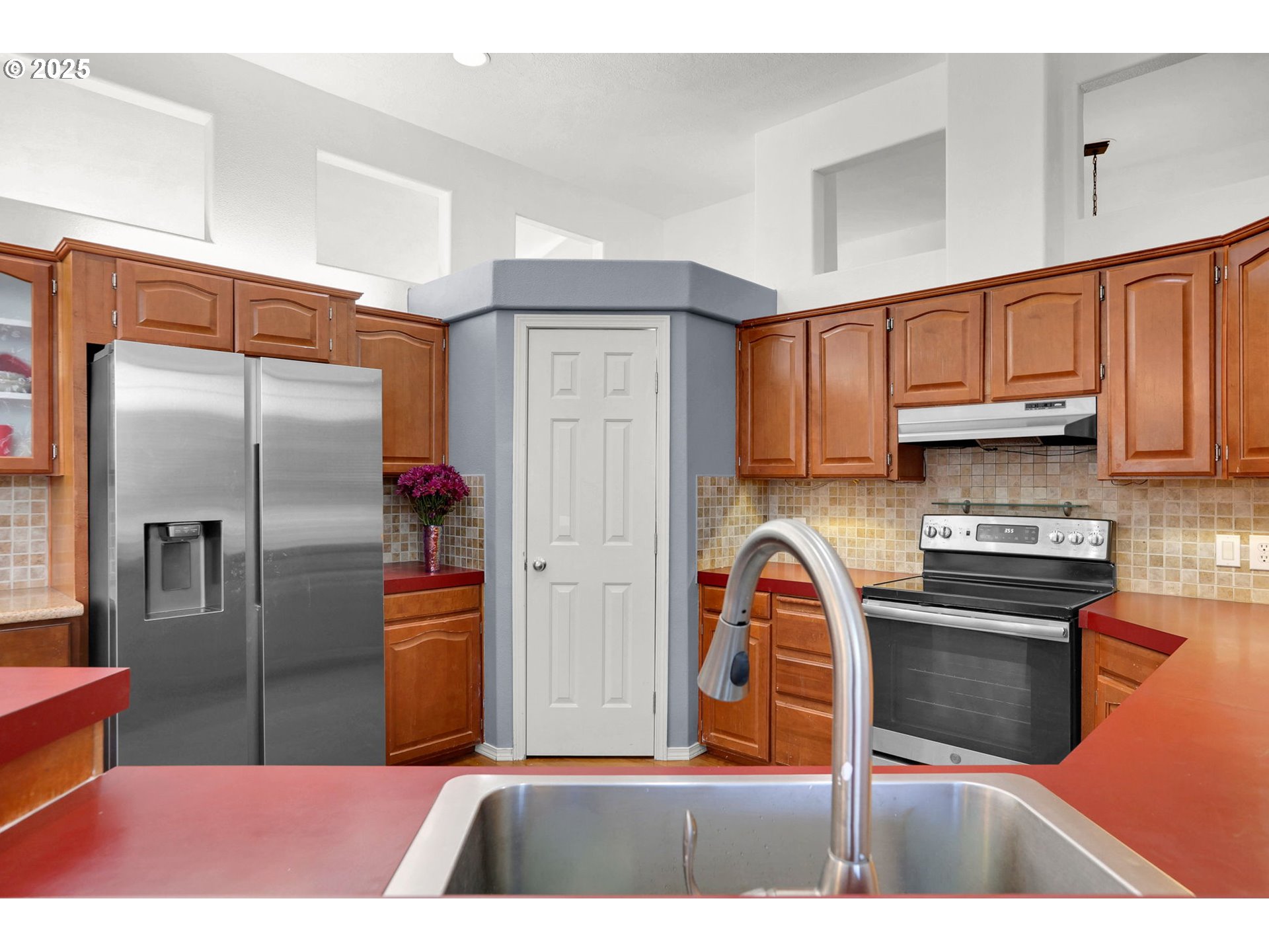5365 Cobblestone Lane Eugene, OR 97402 - Photo 10 of 40 a kitchen with stainless steel appliances granite countertop a refrigerator a stove and a sink