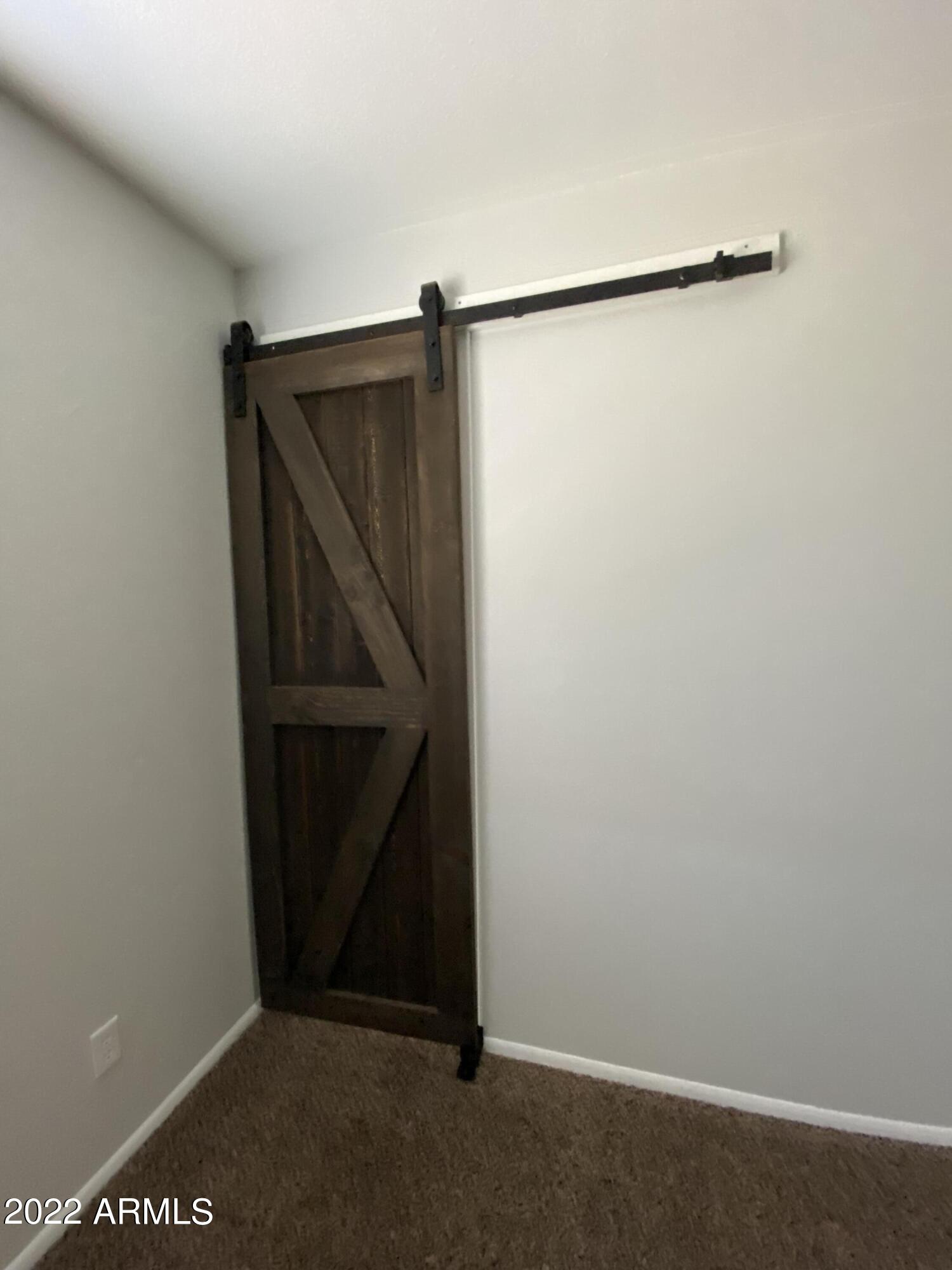 3244 West Yucca Street Phoenix, AZ 85029 - Photo 17 of 21 a view of an empty walk in closet