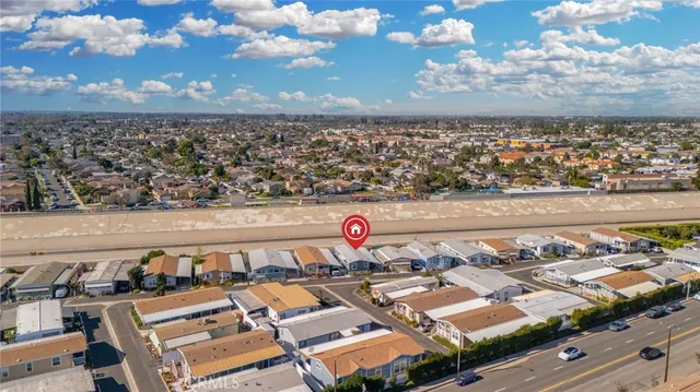 a view of a house with backyard porch and sitting area