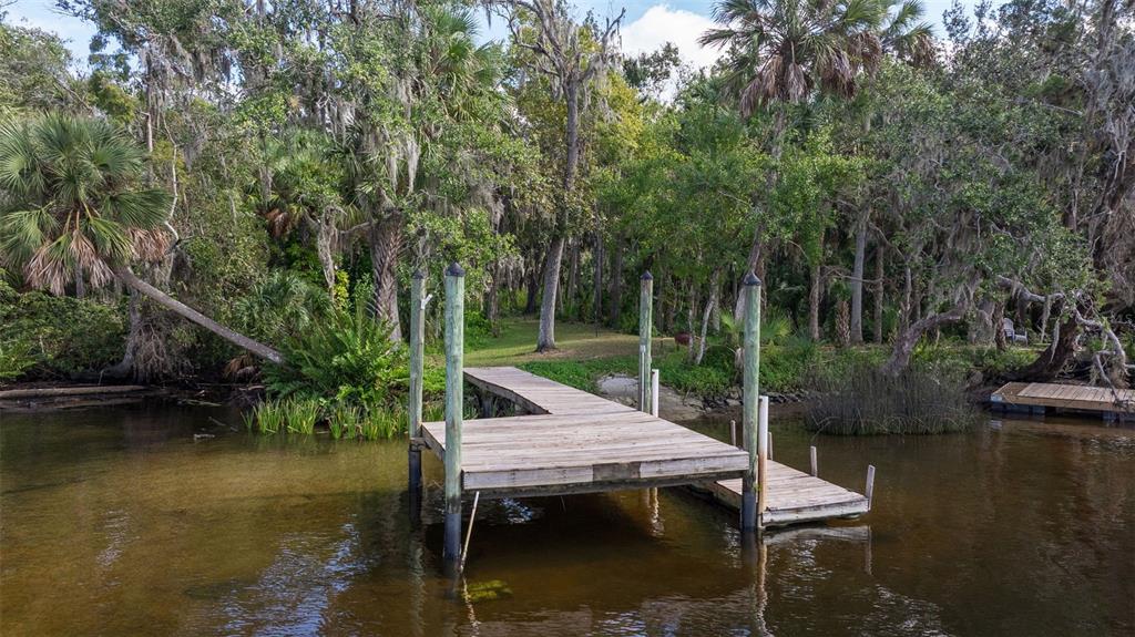 a wooden deck with lake view