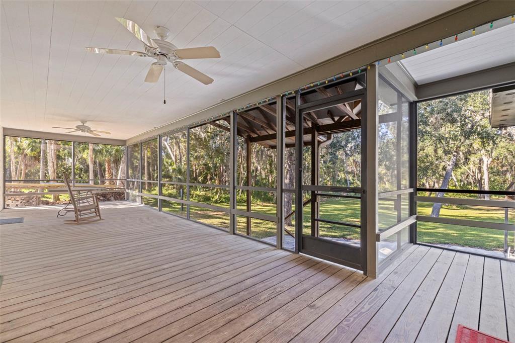 8609 Stoner Road Riverview, FL 33569 - Photo 29 of 66 a view of a porch with wooden floor and outdoor space