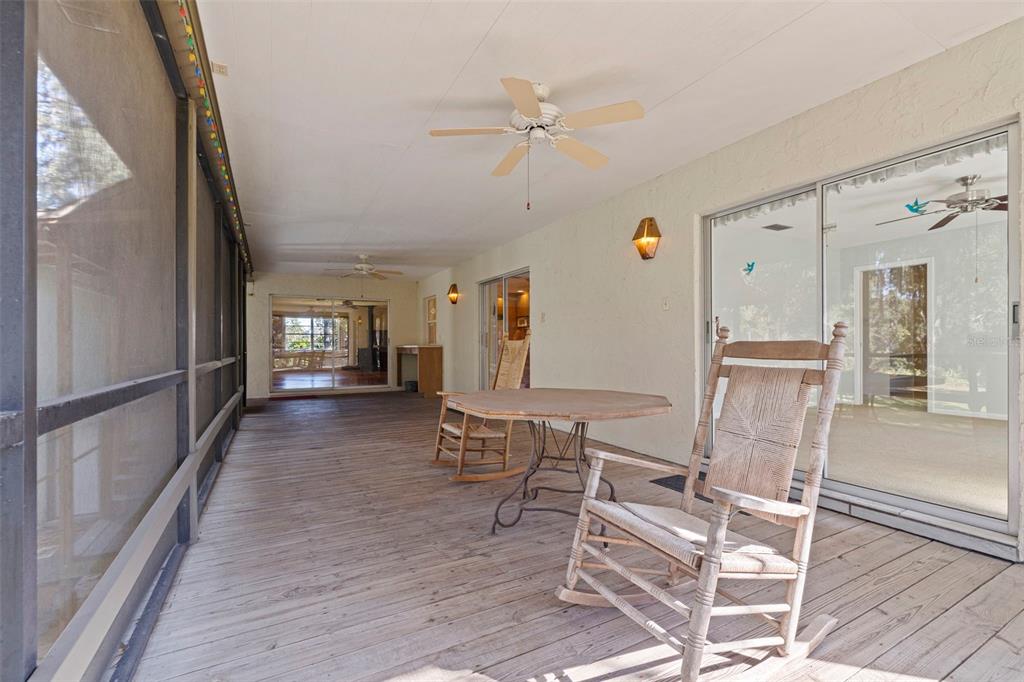 8609 Stoner Road Riverview, FL 33569 - Photo 31 of 66 a view of a livingroom with furniture wooden floor and a ceiling fan