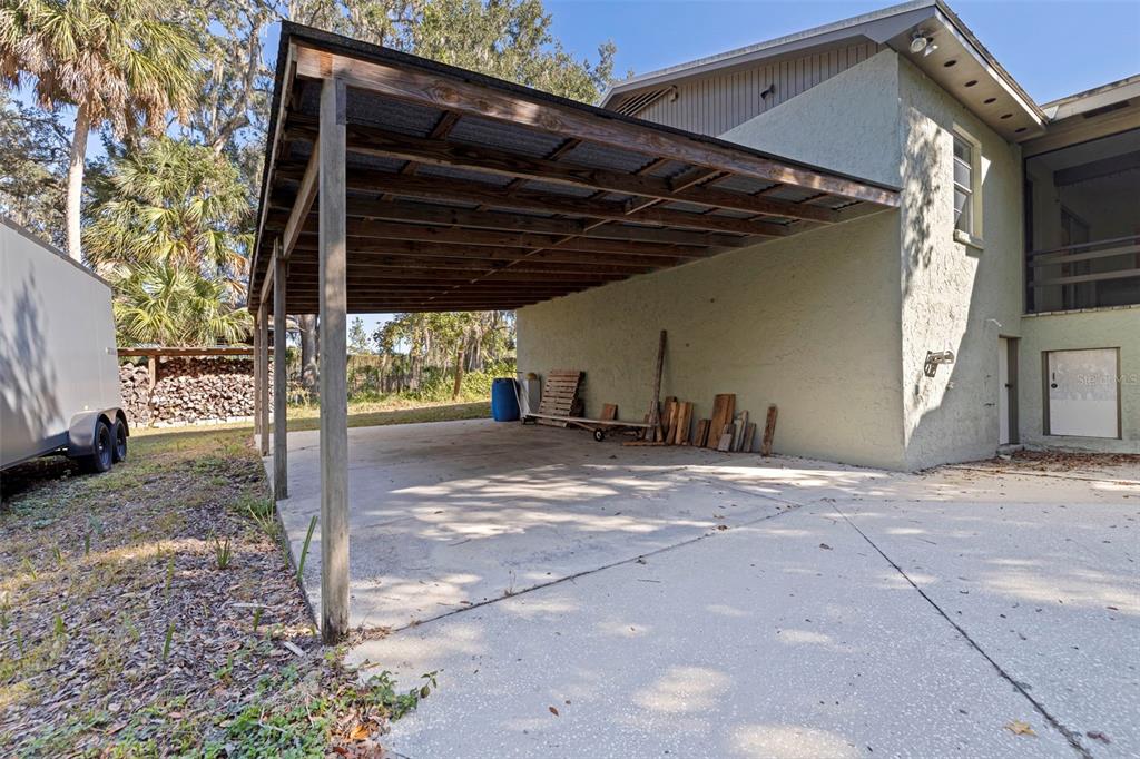 8609 Stoner Road Riverview, FL 33569 - Photo 43 of 66 a backyard of a house with barbeque oven and outdoor space