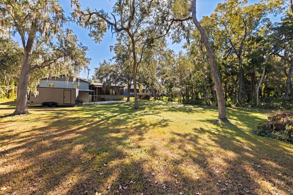 8609 Stoner Road Riverview, FL 33569 - Photo 45 of 66 a swimming pool with trees in the background