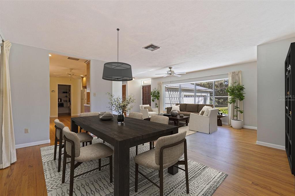 8609 Stoner Road Riverview, FL 33569 - Photo 5 of 66 a view of a dining room with furniture window and wooden floor