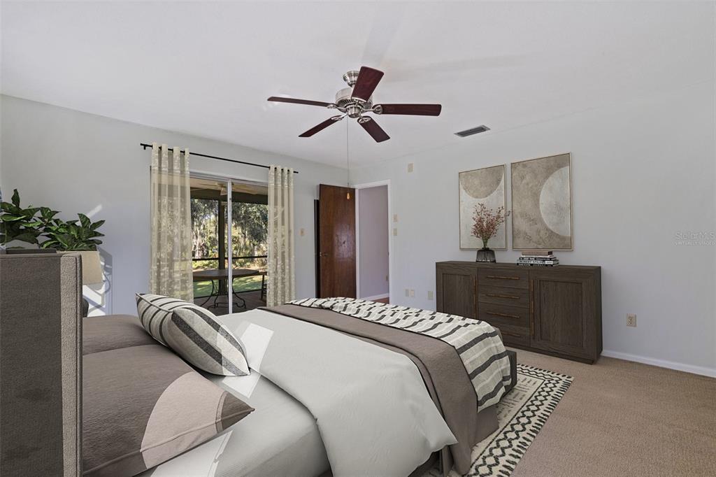 8609 Stoner Road Riverview, FL 33569 - Photo 8 of 66 a bedroom with a bed and potted plant