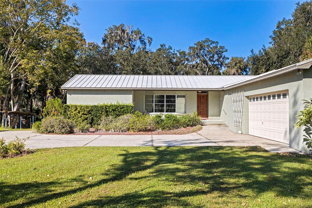 8609 Stoner Road Riverview, FL 33569 - Photo 9 of 66 a front view of a house with a yard