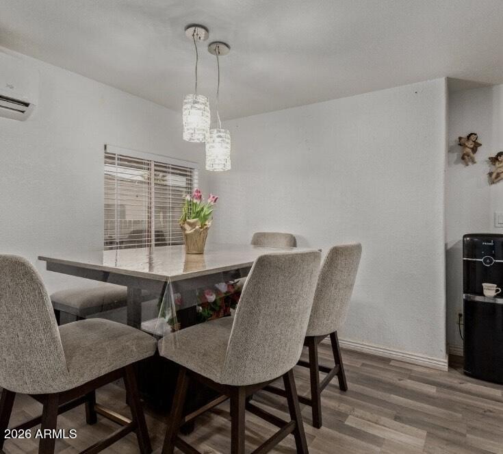 5002 West Bethany Home Road, Unit 104 Glendale, AZ 85301 - Photo 7 of 17 a view of a dining room with furniture window and wooden floor