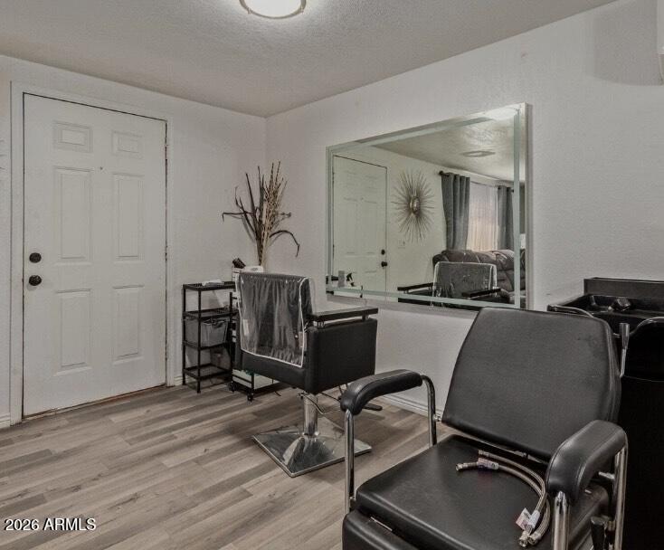 5002 West Bethany Home Road, Unit 104 Glendale, AZ 85301 - Photo 9 of 17 a room with a chair and gym equipment