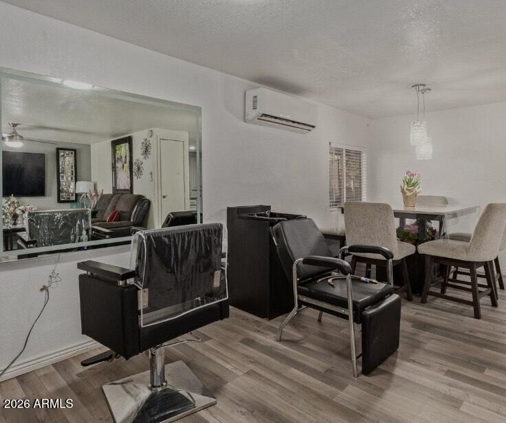 5002 West Bethany Home Road, Unit 104 Glendale, AZ 85301 - Photo 10 of 17 a living room with furniture and wooden floor