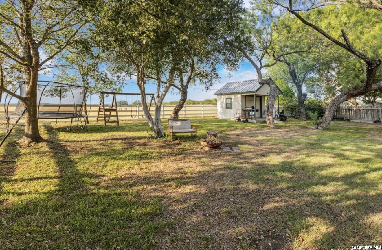 101 Country Castroville, TX 78009 - Photo 14 of 14 a view of a house with a yard and tree s