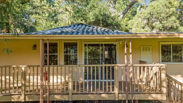 a view of a balcony with wooden floor