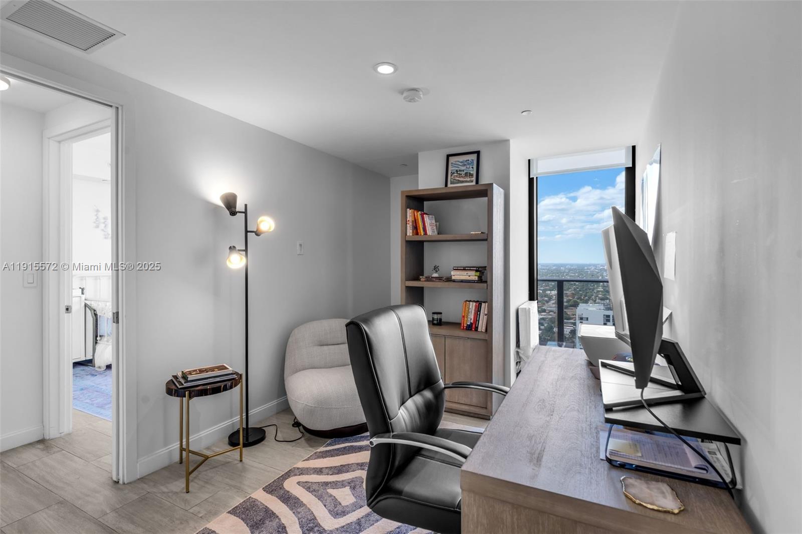 55 Southwest 9th Street, Unit 4008 Miami, FL 33130 - Photo 13 of 36 a view of a workspace with furniture and a window