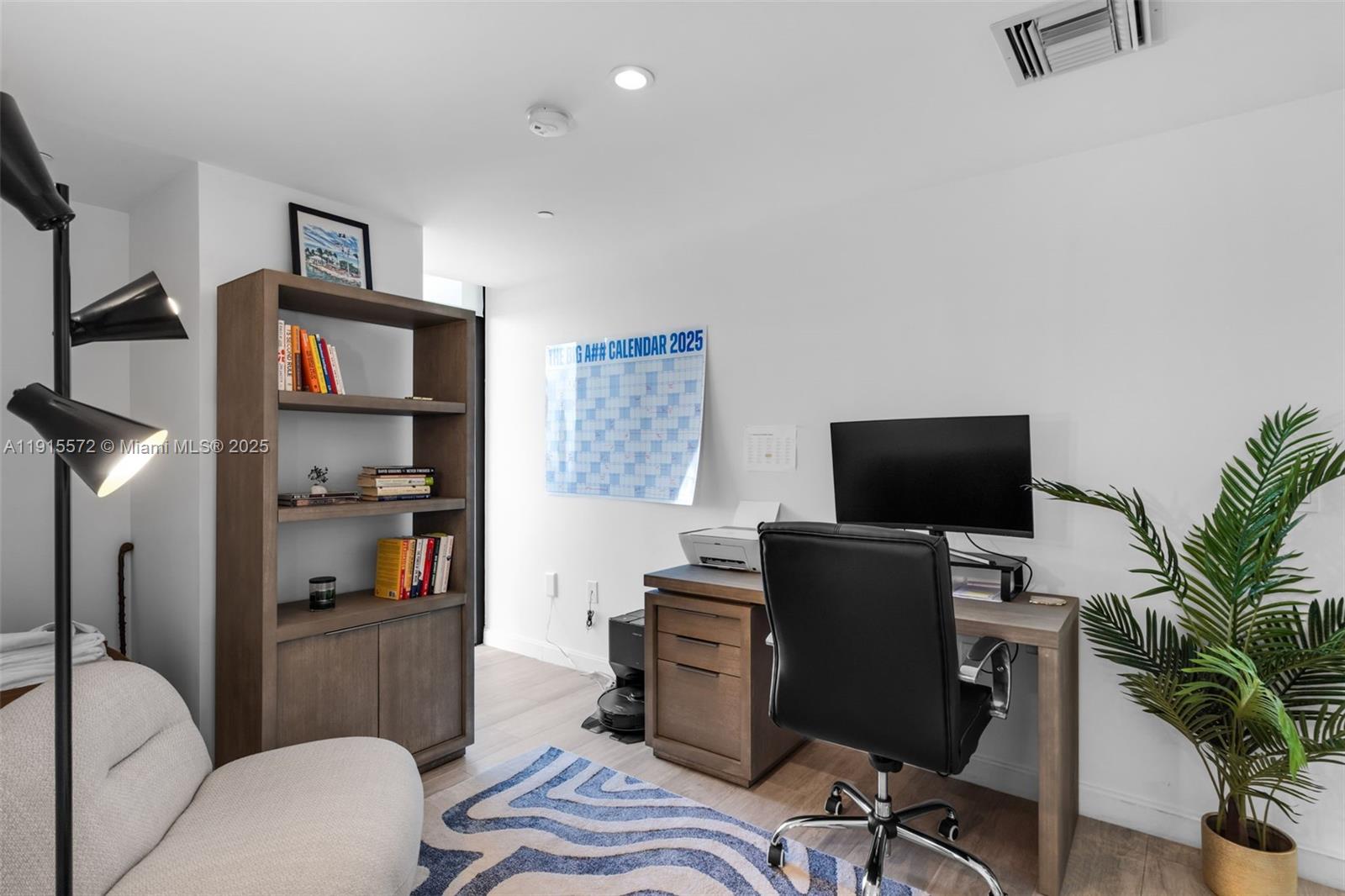 55 Southwest 9th Street, Unit 4008 Miami, FL 33130 - Photo 14 of 36 a view of a livingroom with workspace and a couch