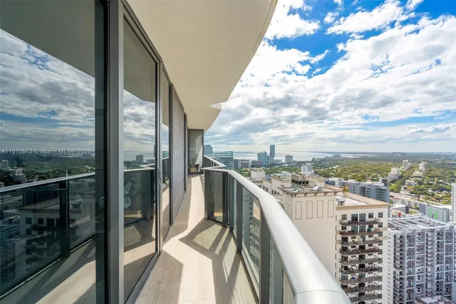 a view of a balcony with city view