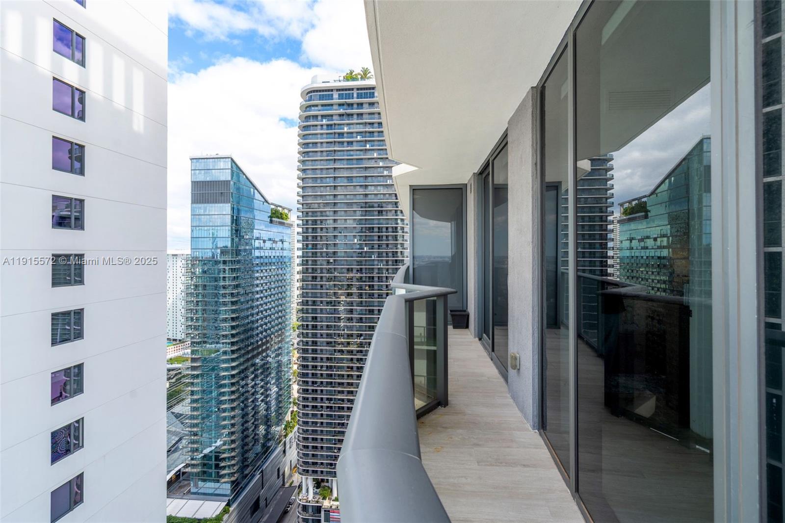 55 Southwest 9th Street, Unit 4008 Miami, FL 33130 - Photo 23 of 36 a view of balcony with wooden floor