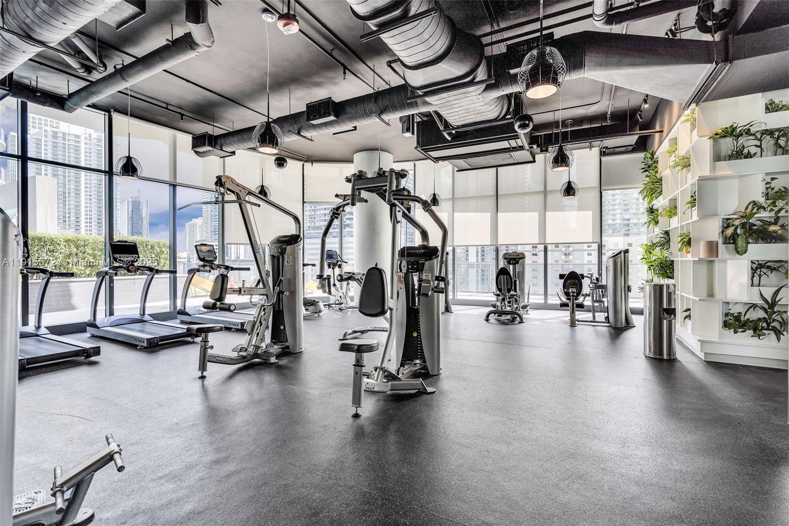 55 Southwest 9th Street, Unit 4008 Miami, FL 33130 - Photo 30 of 36 a view of a room with gym equipment