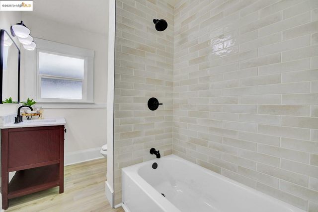 a bathroom with a bathtub and a sink