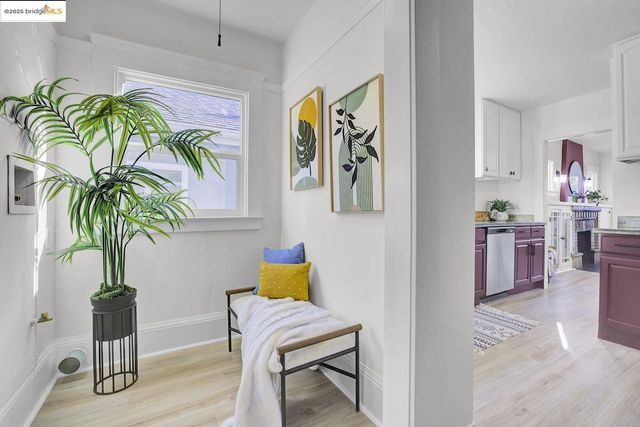 a view of a livingroom with furniture and a potted plant