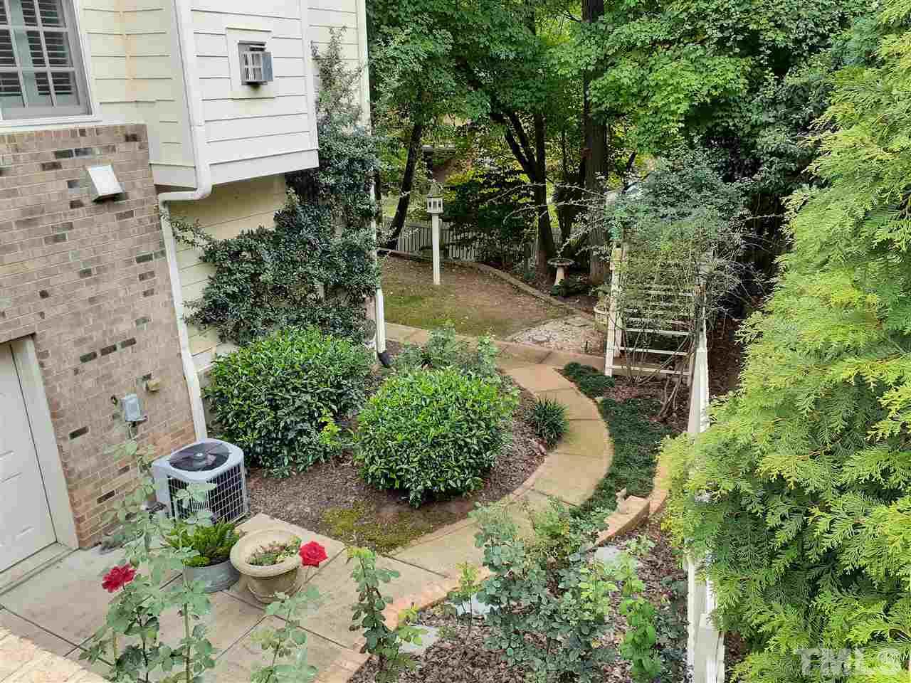 403 Yarmouth Road Raleigh, NC 27608 - Photo 2 of 30 a backyard of a house with lots of green space
