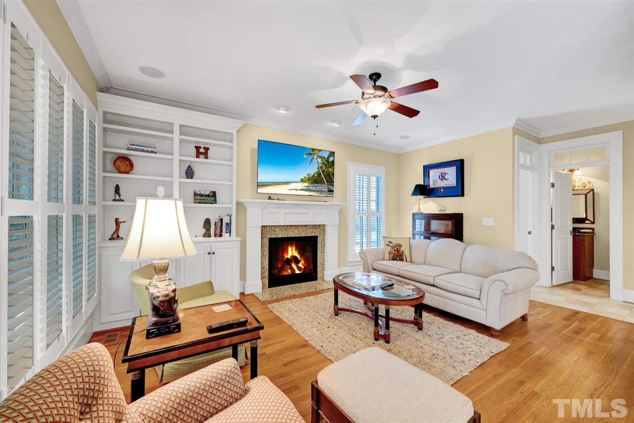 403 Yarmouth Road Raleigh, NC 27608 - Photo 13 of 30 a living room with furniture and a fireplace