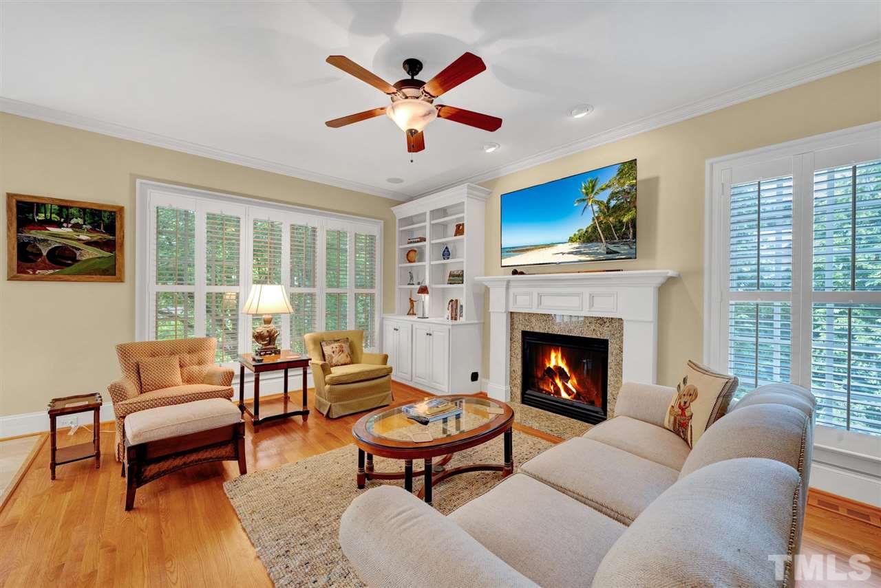 403 Yarmouth Road Raleigh, NC 27608 - Photo 14 of 30 a living room with furniture a fireplace and a large window
