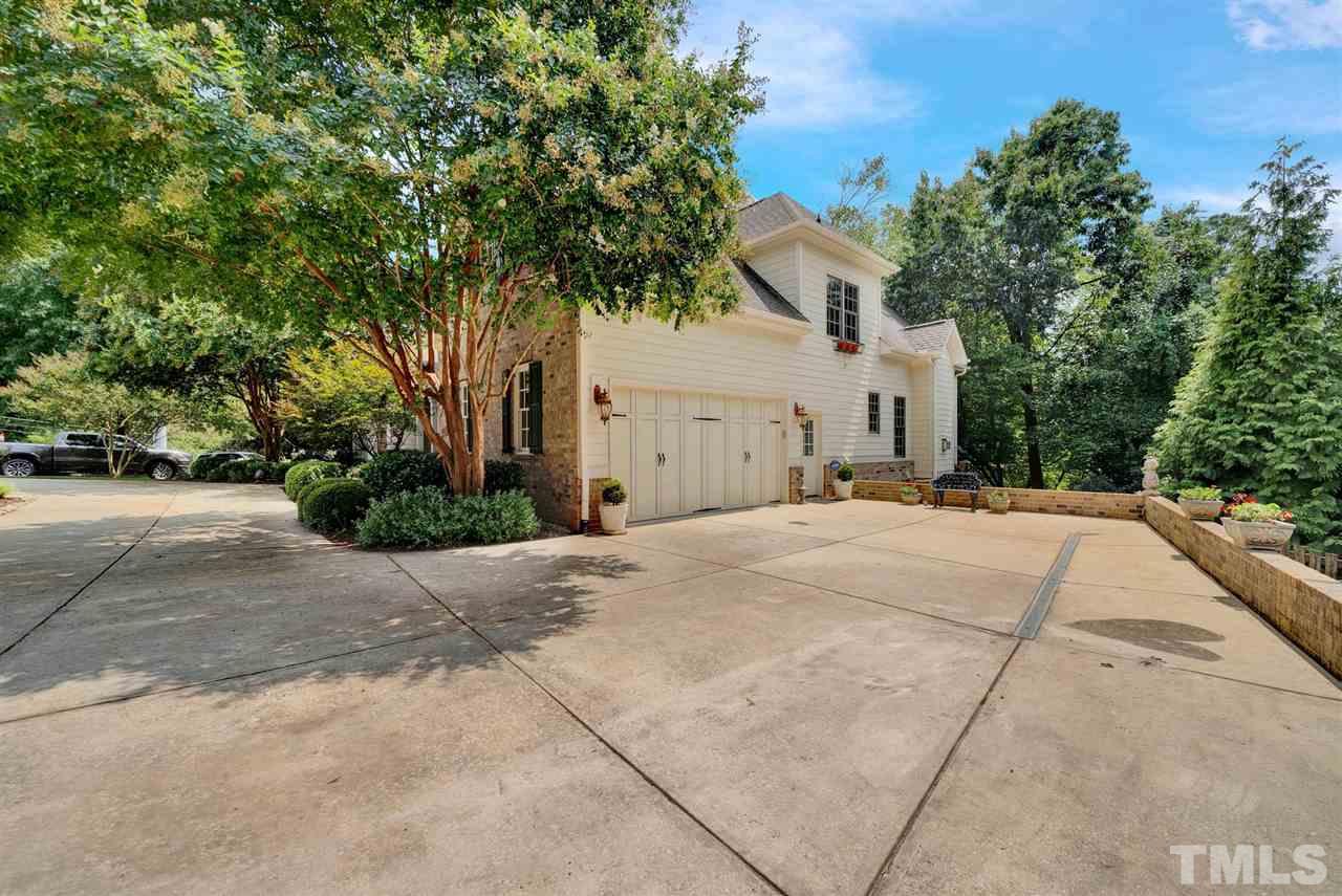 403 Yarmouth Road Raleigh, NC 27608 - Photo 3 of 30 a front view of a house with a yard and garage